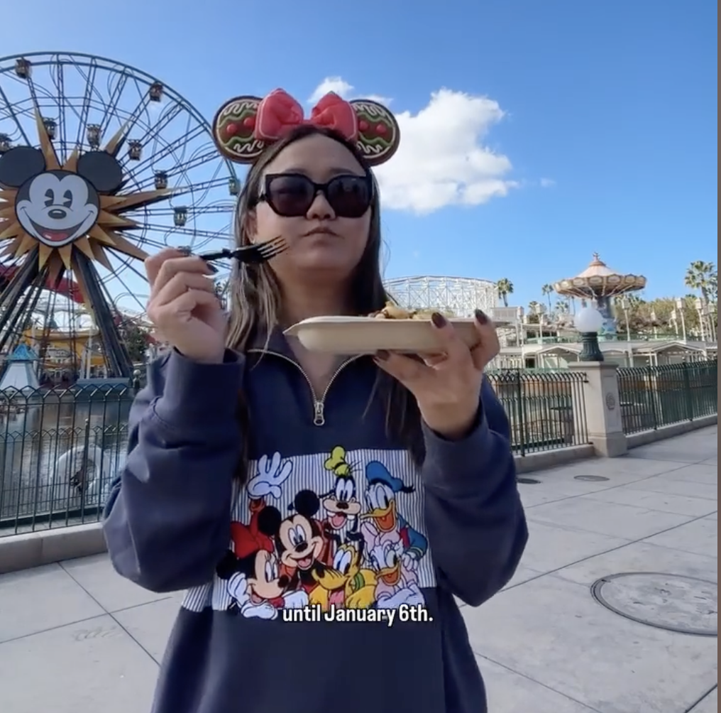 person eating vegetarian food at Disneyland